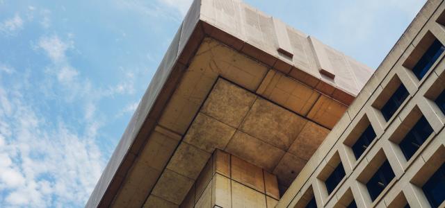 brown concrete building under blue sky during daytime by Jack Young courtesy of Unsplash.