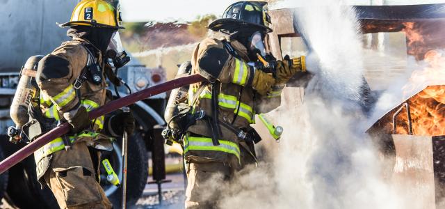 three fireman preventing fire during daytime by Matt C courtesy of Unsplash.